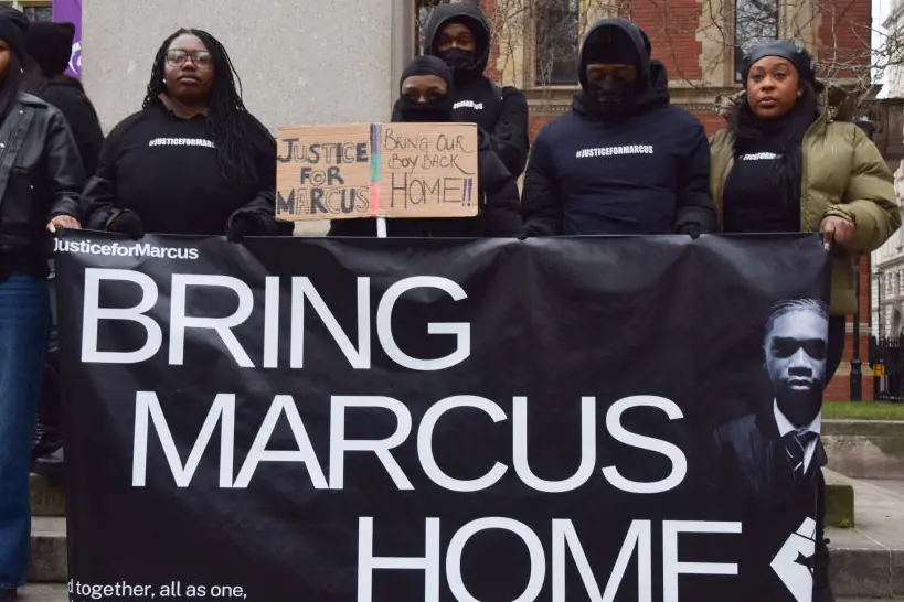 Protesters hold a 'Bring Marcus Home' banner during the demonstration in Parliament Square. Credit: SOPA Images / Getty